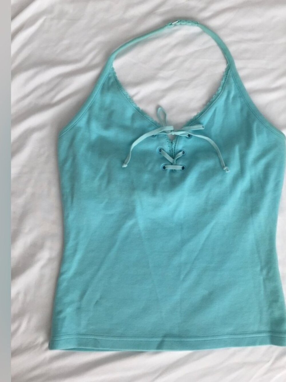 Tank top with tie up accent.